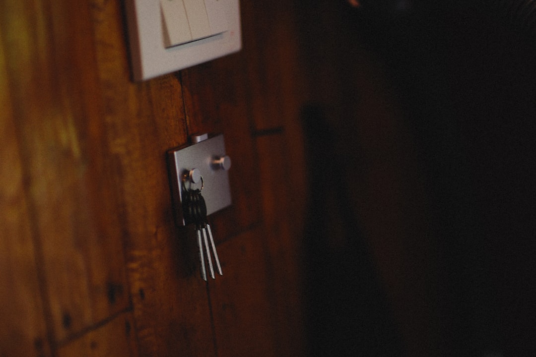 Two distinct sets of house keys, one ornate and one modern, lie on a clean surface, representing the choice between traditional and discount real estate brokerages.